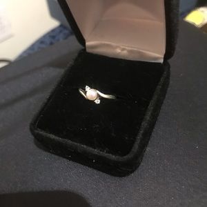 Sterling silver pearl ring with two small diamonds